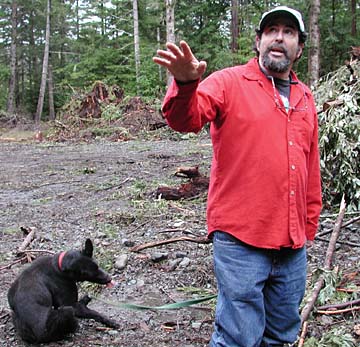 Sal Steinberg and dog standing in the clearcut area