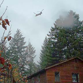 helicopter flying above cabin